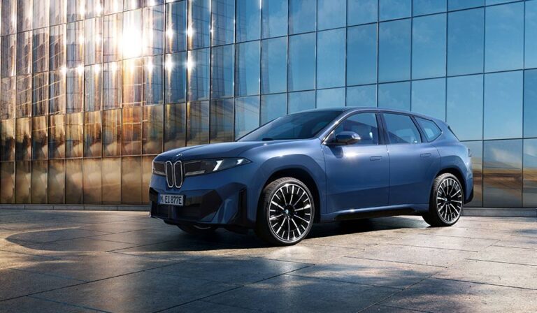 2026 BMW iX3 Neue Klasse side profile driving on desert highway